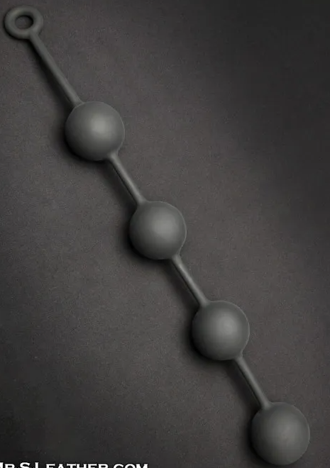 A black silicone chain of four black silicone anal beads