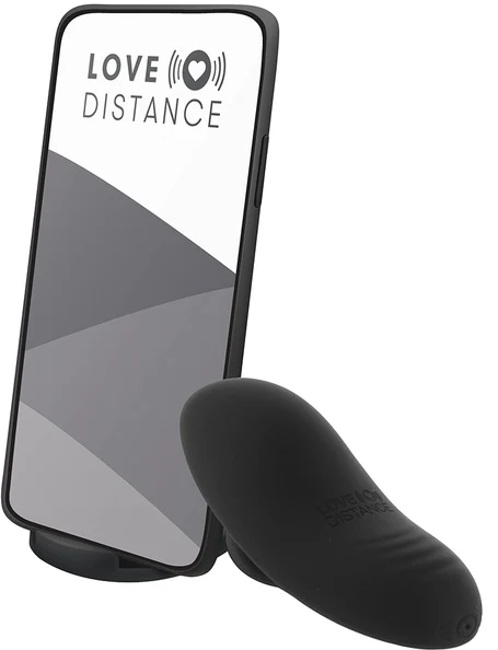 A small black vibrator designed to be worn inside the vagina, pictured with a smartphone to indicate that it's app-controlled